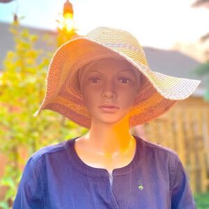 Straw hat with muted color stripe